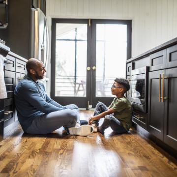 Father and teen son talking