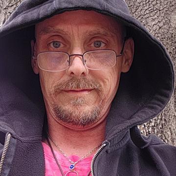 Michael Evrard in a hoodie