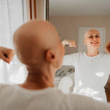 cancer patient looking in mirror