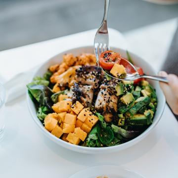 Person eating a salad