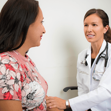 A City of Hope doctor consults with a patient