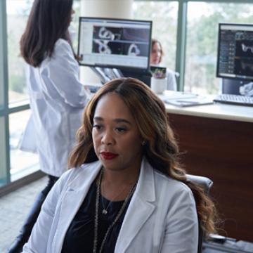 A City of Hope doctor reviewing a patient's mammogram images