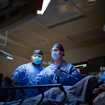 Doctors performing surgery on patient