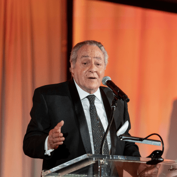 Frank Di Bella speaking at podium at Let's Be Frank gala