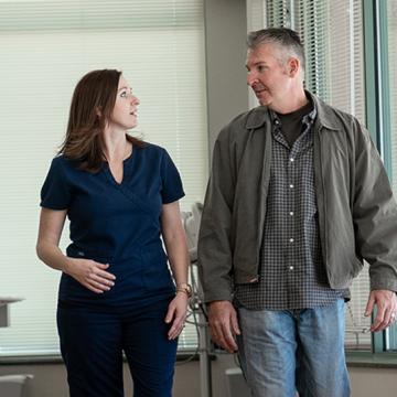 Nurse walking with patient