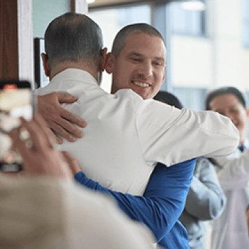 Volunteers at City of Hope hug