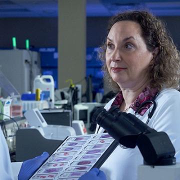 A male and a female doctor discuss results