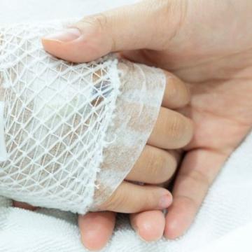 Nurse holding the hand of a patient