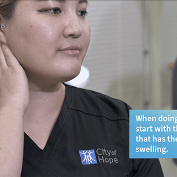 Occupational therapist demonstrating head and neck stretches.