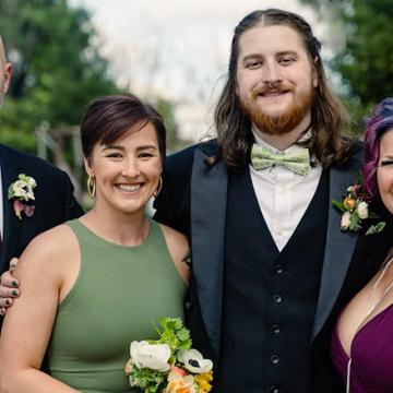 The Myers family dressed up and smiling together