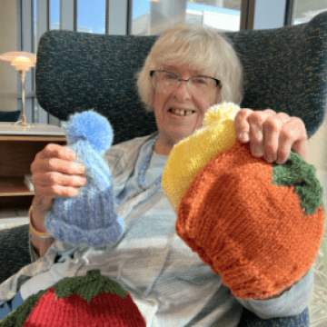 Grateful patient gifts handmade hats to City of Hope Orange County