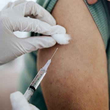 image of person receiving a shot in the arm