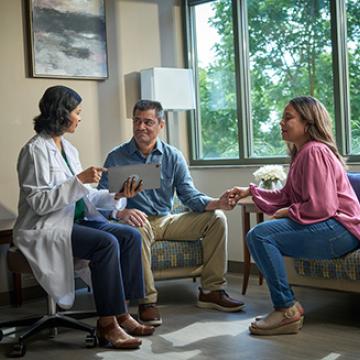 Consultation with lung cancer doctor and patient and his wife