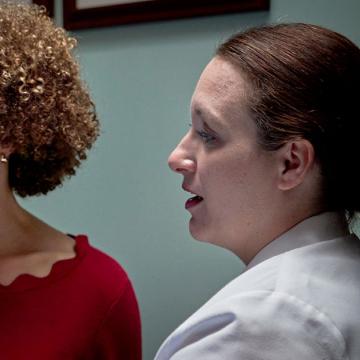 image of a female doctor explaining a chart to a woman