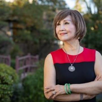 Dolly Chua wearing red and black dress