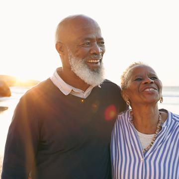 Couple Walking On Beach