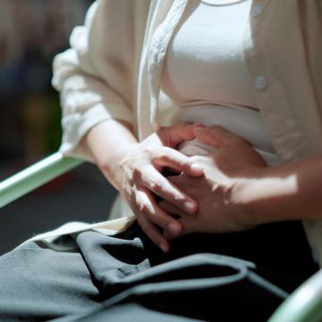 Female holding her stomach