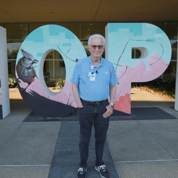 Jack H. in front of HOPE letters