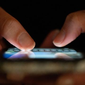 Close up of person using an app on their phone
