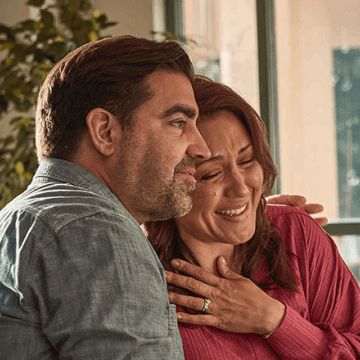 Couple speaking to a doctor about survivorship programs
