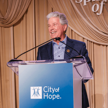 Dan Hedigan at podium speaking at CIA Spirit of Life event