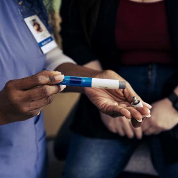 Hospital worker opening an ozempic pen