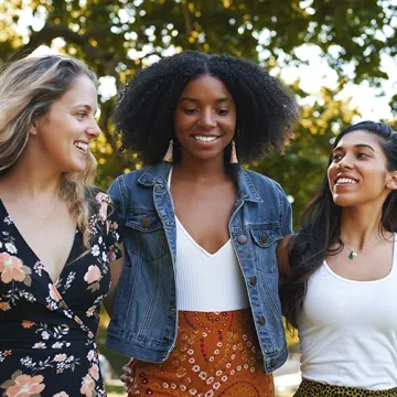 Three women walking together outdoors