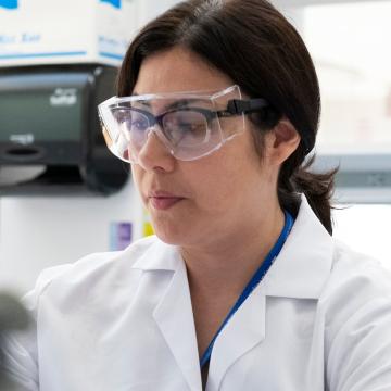 Female Scientist with Goggles in Lab