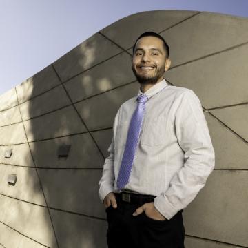 Young stomach cancer survivor Jason Diaz smiling confidently