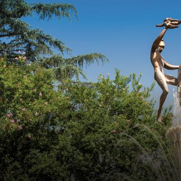 The Spirit of Life fountain on campus depicts two parents lifting a child with joy