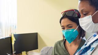 Two employees working on insurance