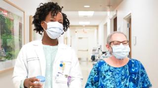 A doctor and patient walking