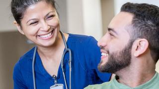 Nurse and patient smilling Getty Images
