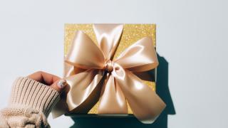 Wrapped gift with a gold bow