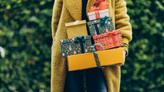 Woman holding holiday gifts