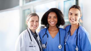 Three women doctors standing together