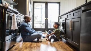 Father and teen son talking