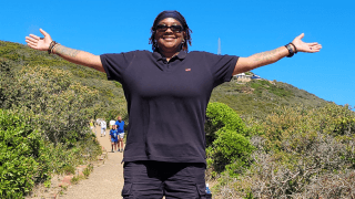 Lung Cancer Survivor Devonne Swift enjoying the outdoors with open arms