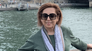 City of Hope patient Ida Yaghoobians smiling on a bridge