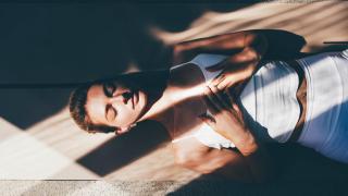 Woman laying down meditating