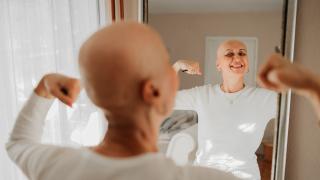 cancer patient looking in mirror