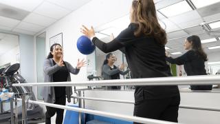 A City of Hope physical therapist works with a patient