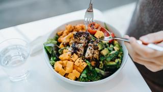 Person eating a salad