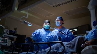 Doctors performing surgery on patient