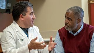 image of a doctor conferring with a patient