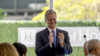 Robert Stone clapping at Cherng Center Ceremony
