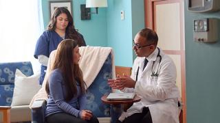 City of Hope physician, Ajaz Khan M.D., consulting a patient.