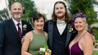 The Myers family dressed up and smiling together