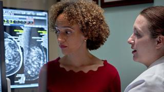 image of a female doctor explaining a chart to a woman