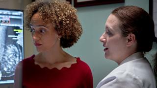 image of a female doctor explaining a chart to a woman